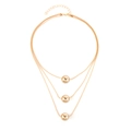 Three-layer gold layered necklace with round metallic bead pendants and lobster clasp - Sphere