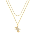Double layered gold necklace featuring a minimalist sparkling starburst pendant and zirconia - Star