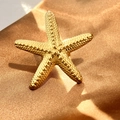 Textured gold starfish ring made of stainless steel on a luxury satin background - Starfish Shape (JZ-YS321-G)