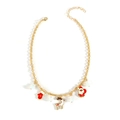 Christmas necklace with gold chain featuring Santa Claus, reindeer, and red glove charms - Enamel Santa Style (NK26310-Red)