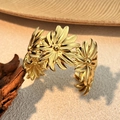 Detail of 18K gold plated daisy flower cuff bangle in minimalist stainless steel finish - Daisy Style (SS-YS110-1)