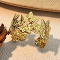 Macro detail of 18K gold plated bangle featuring embossed rose floral and leaf textures - Rose Style (SS-YS110-3)