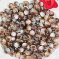 Macro shot of colorful 10mm resin cat-eye beads for DIY jewelry making on white ceramic - Coffee Pink Gray (4#)