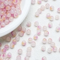 Close-up of pink and yellow gradient round glass beads for DIY jewelry making - Peach (A1)