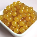 Macro shot of 8mm yellow translucent glass beads for DIY jewelry making in a white bowl - 8mm / Topaz Yellow