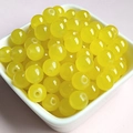 Macro shot of 8mm translucent yellow glass jade round beads for DIY jewelry crafting - 8mm / Lemon Yellow