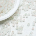 Macro detail of 8mm translucent jelly beads with subtle opalescent color shifts for DIY crafts - Orange-Blue (A21)