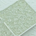 Detailed macro view of clear jelly glass beads stored in a grid organizer box - Jelly Beads (A405) / 6mm / White