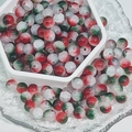 Close-up of red, green, and white glass crackle beads in a ceramic tray for DIY jewelry - Christmas Opal Crackle (M135#)