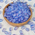 Macro shot of 6x10mm rectangle aurora glass beads with ice crack texture in a wooden tray - Blue Purple (K41)