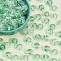 Close-up of green and white floral glass beads with central drill holes for DIY jewelry - Transparent Drifting Green (A354#)