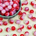 Detail of red and purple crackle glass beads in a green bowl for DIY jewelry making - Opal Red Crackle (M3#)