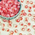 Detailed close-up of pink frosted glass beads with gold foil inside for DIY jewelry making - Frosted Gold-Red (D9#)