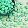 Detailed macro view of 8/10mm emerald green crackle glass beads for jewelry making - Green Snowflake Crackle (M381#)