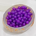Macro view of purple chalcedony beads in a natural agate bowl for jewelry making - 10mm / Deep purple