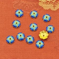 Macro shot of royal blue enamel flower bead spacers with gold finish for DIY jewelry making - 9mm / Royal Blue (P126)