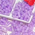 Detailed macro view of purple bamboo-shaped glass beads with gold marble texture for DIY - J54 Brushed Jade Style Bamboo Purple