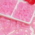 Macro shot of 12x6mm pink bamboo-shaped glass beads with gold foil for DIY jewelry - J58 Brushed Jade Style Bamboo Pink