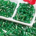 Detailed macro view of dark green bamboo shaped glass beads with golden cracked texture - J60 Brushed Jade Style Bamboo Dark Green