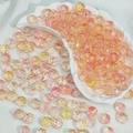 Macro detail of faceted pink and yellow gradient acrylic beads for DIY jewelry making - Orange Pink Gradient (B103)