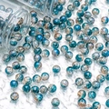 Detail of 10mm cracked blue glass beads spilling from bottles for DIY jewelry making - Silver Wire Crackle Style (H285) / 10mm / Dark Blue