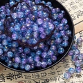 Detail of 10mm cracked glass beads with gold cloud patterns and blue-purple gradient - Two-Tone Crackle Style (H211) / 8mm / Violet Blue