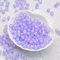 Macro detail of 10mm purple and blue gradient crackle glass beads in a white shell dish - Blue Purple Style(H22)