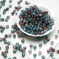 Detailed view of 10mm colorful crackle glass beads in a white decorative bowl for DIY jewelry - Red Blue Style(H123) / 10mm