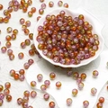 Macro detail of 10mm multi-color crackle glass beads with unique ice-crack textures - Orange Pink Style(H125)