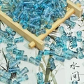 Macro detail of blue translucent ink-style bamboo beads for DIY jewelry making - Ink Wash Bamboo Ink Blue (J221# 6x12mm)