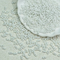 Detailed view of white peanut seed beads in a ceramic bowl for jewelry DIY - 10g/Pack / White