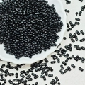 Macro shot of unique black double-hole dumbbell seed beads for DIY jewelry making - 10g/Pack / Black