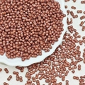 Macro shot of 3x6mm reddish brown dual-hole glass peanut beads for DIY jewelry making - Dark Coffee