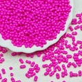 Detail shot of bright rose red twin seed beads with double holes for DIY jewelry making - Rose Red