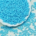 Detailed view of light blue dual-hole peanut beads for handcrafted jewelry making - Lake Blue