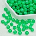 Vibrant translucent green glass beads in a hexagonal tray for DIY jewelry making - Chalcedony Apple Green (E11#) / 8mm