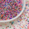 Mix of 3mm colorful glass seed beads in a white ceramic bowl for DIY jewelry making - 10 g / Mixed Colors (3mm)