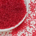 Macro detail of 3mm transparent red glass seed beads for DIY jewelry making and crafts - Red (3mm)