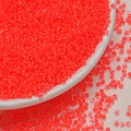 Macro shot of 3mm bright orange-red translucent glass seed beads for DIY jewelry making - Watermelon Red (3mm)