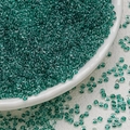 Macro view of 3mm tiffany blue glass seed beads with glossy finish for jewelry - Dark Green (3mm)