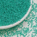 Macro shot of 3mm teal glass seed beads for DIY jewelry making on white background - Lake Green (3mm)