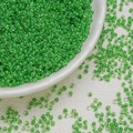 Detailed view of 3mm green dyed core glass seed beads for handmade DIY jewelry crafts - Emerald Green (3mm)