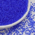 Macro shot of 3mm transparent dark blue glass seed beads in a white ceramic dish - Navy Blue (3mm)