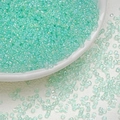 Close-up of 3mm mint green glass seed beads with iridescent AB coating for DIY jewelry - Cyan Green