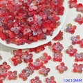 Detailed view of 10mm iridescent red four-petal glass flower beads for DIY jewelry making - Dark Red (L950)