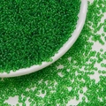 Green transparent 3mm glass seed beads for DIY jewelry making in a white ceramic bowl - Dark Green