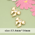 Golden bow-shaped earring charms with heart zircon crystals, size 13.4mm x 14mm for DIY - Bow Heart Style (MG5602A)