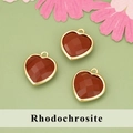 Trois pendentifs rhodochrosite en forme de cœur facetté avec bord doré et anneau - Rhodonite