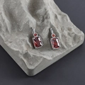 Detail of silver drop earrings featuring large rectangular red zircons in 4-prong setting - Red Silver (M99905)