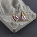 Detail view of rectangular purple zircon pendants with 18k gold plating on stone base - Purple Gold (M99909)